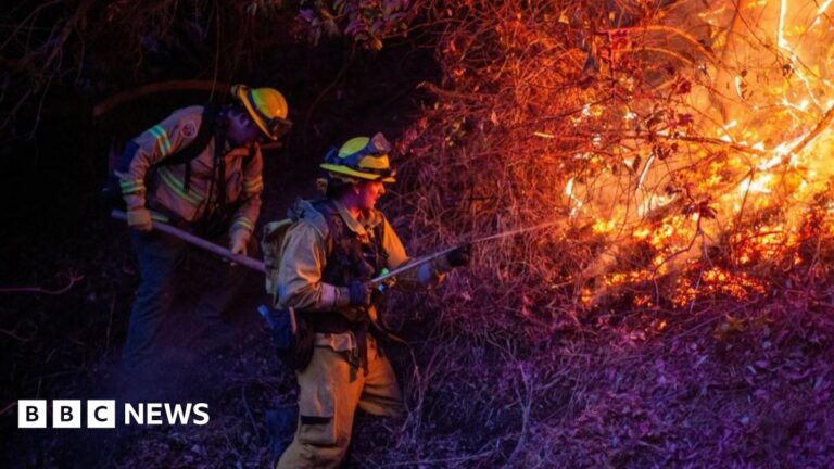 Firefighters work near a church destroyed in the Palisades Fire, in the Pacific Palisades neighborhood in Los Angeles, California, U.S. January 10, 2025.