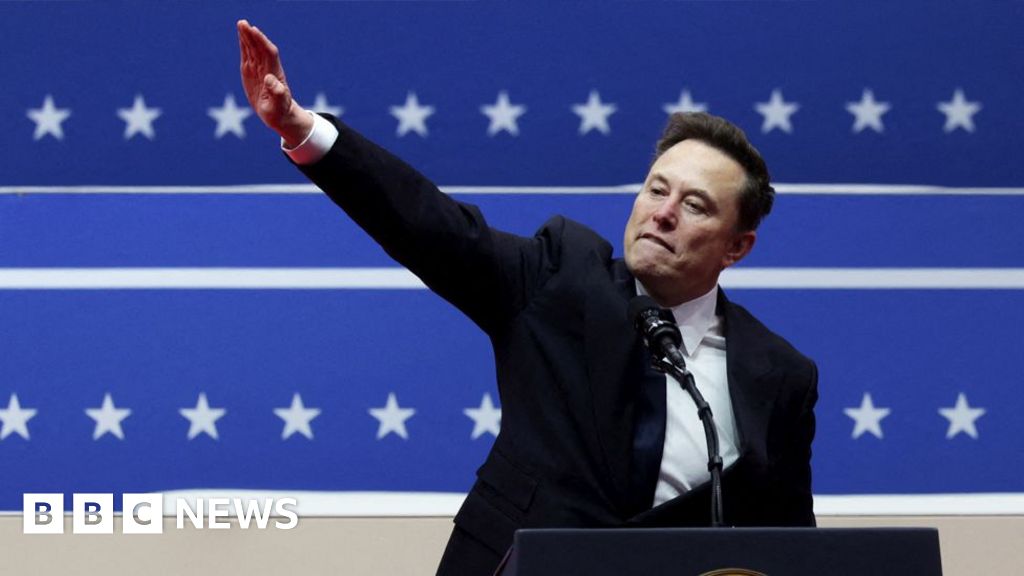 Trump supporter Elon Musk gestures at a post-inauguration rally.