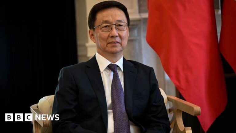 The Vice President of China Han Zheng sits in front of China