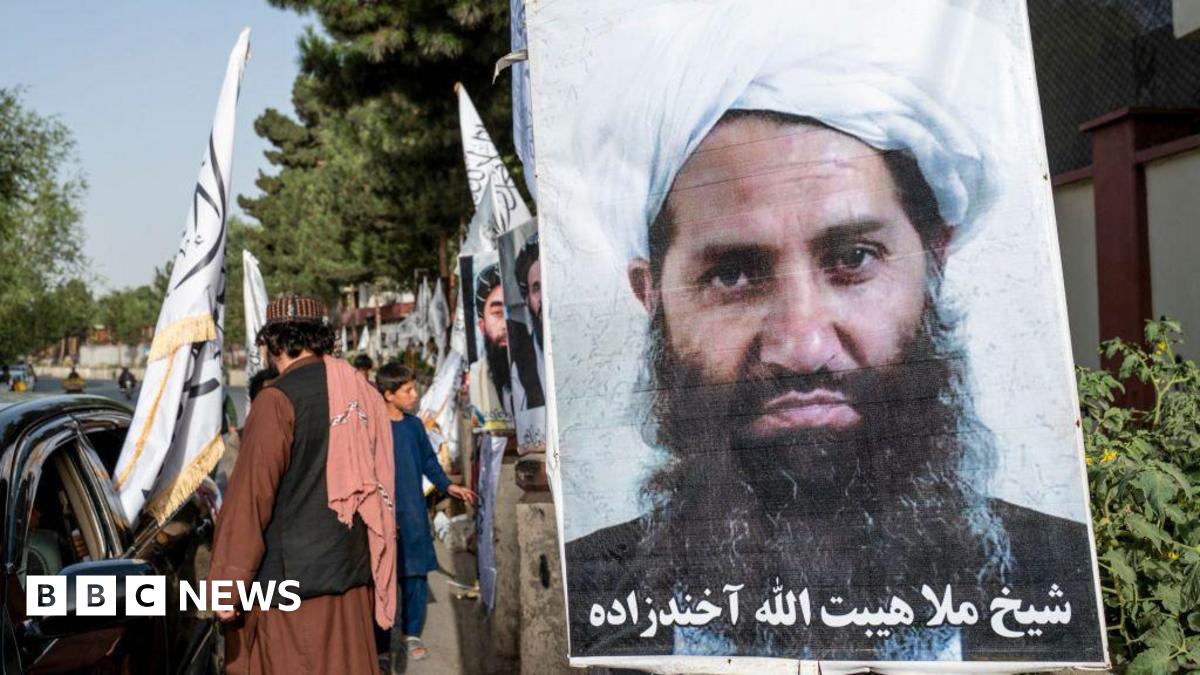 A poster of Taliban Supreme Leader Hibatullah Akhundzada is seen along a road in Kabul on 14 August 2023
