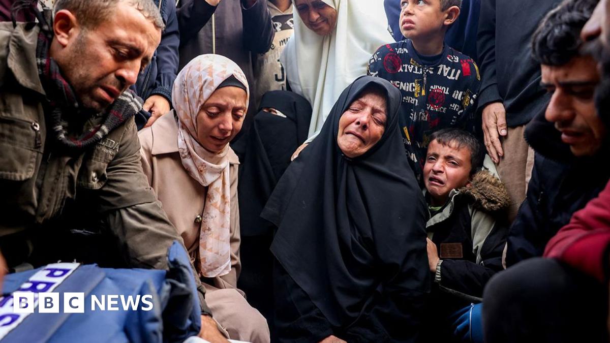 A group mourn the death of  journalist Ahmad Al-Shayah killed overnight in Khan Younis.