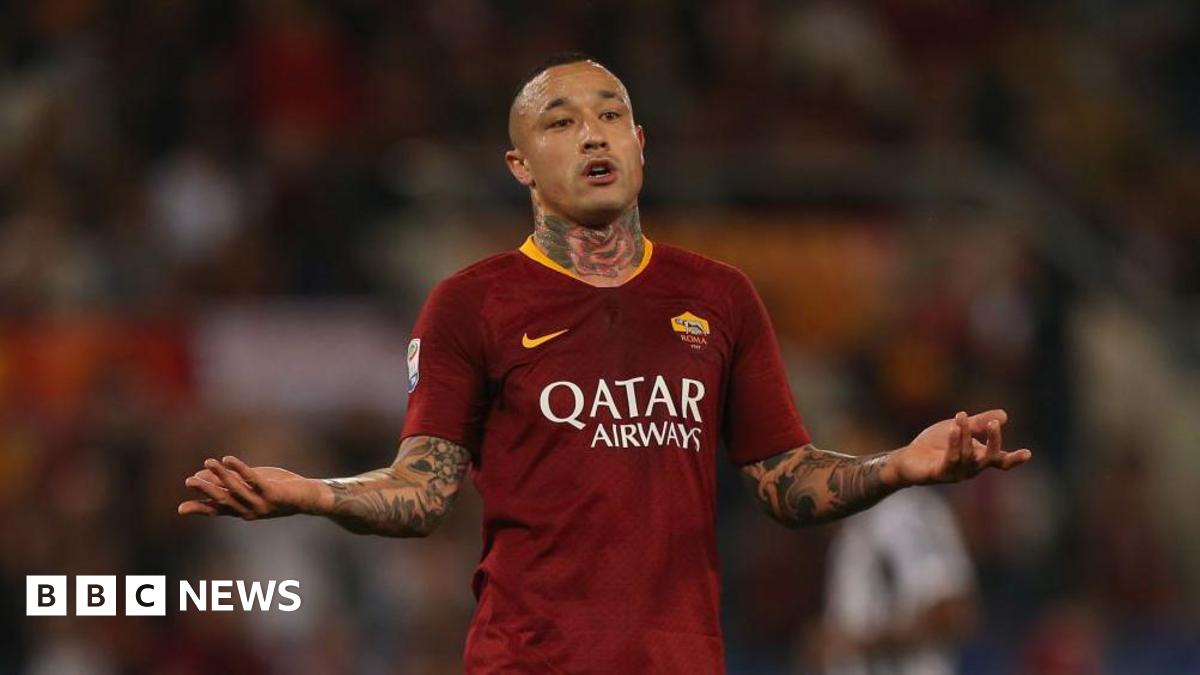 Nainggolan playing for Roma, sticking his arms out in protest