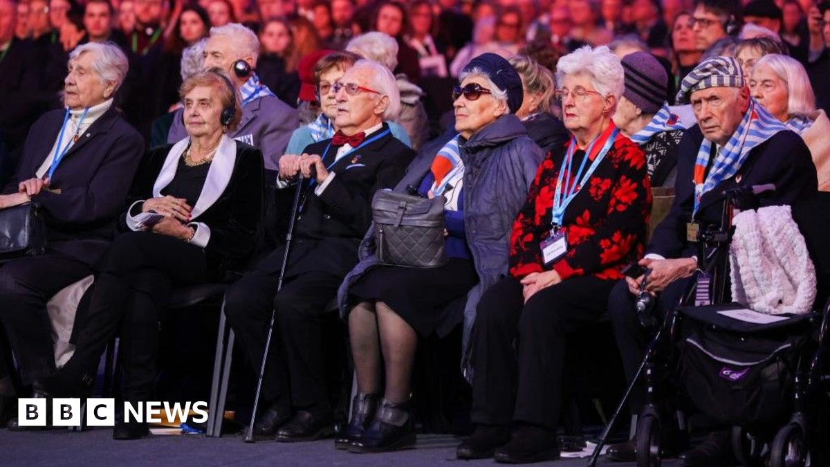 Polish President Andrzej Duda and Piotr Cywinski, Auschwitz Museum director, pay homage at