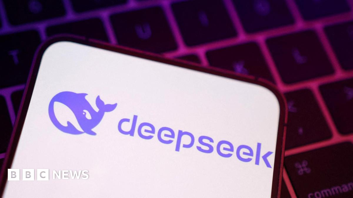 A phone screen with the DeepSeek logo, a cartoon purple whale.