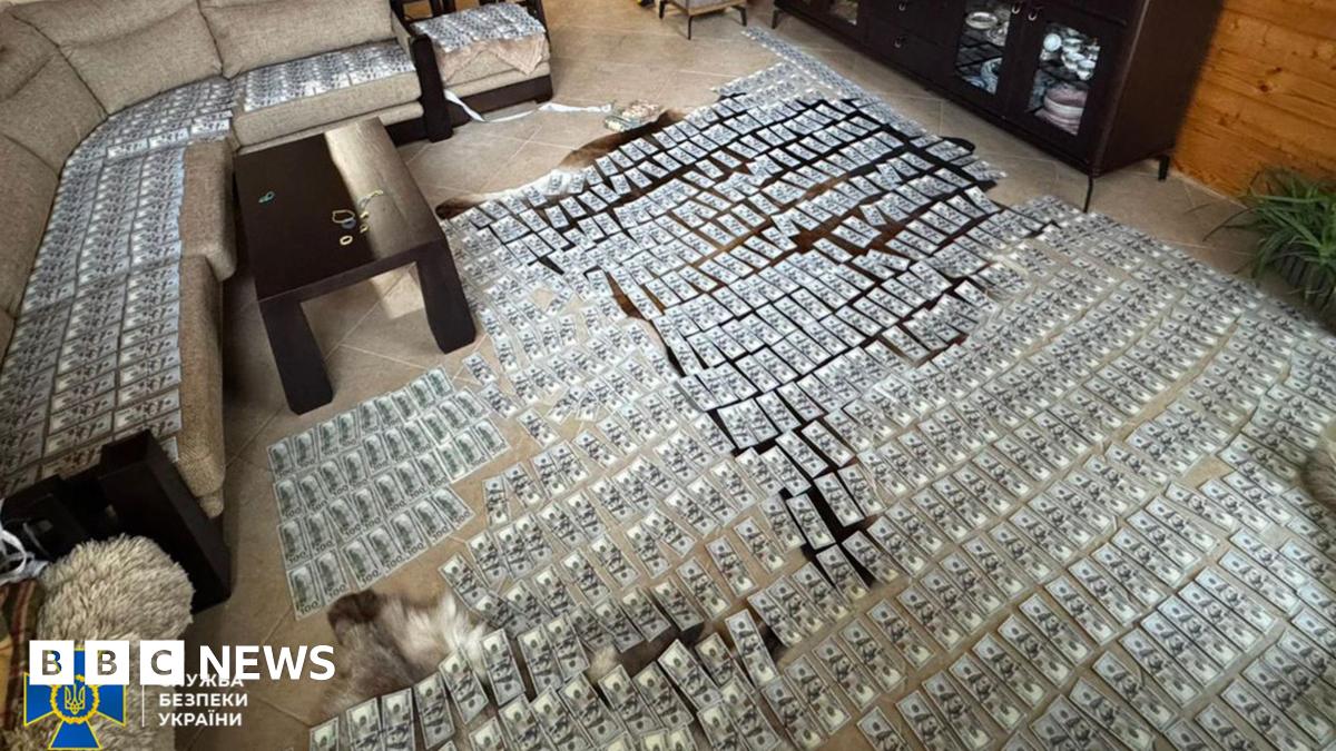 Hundreds of dollar banknotes lying on a living room floor