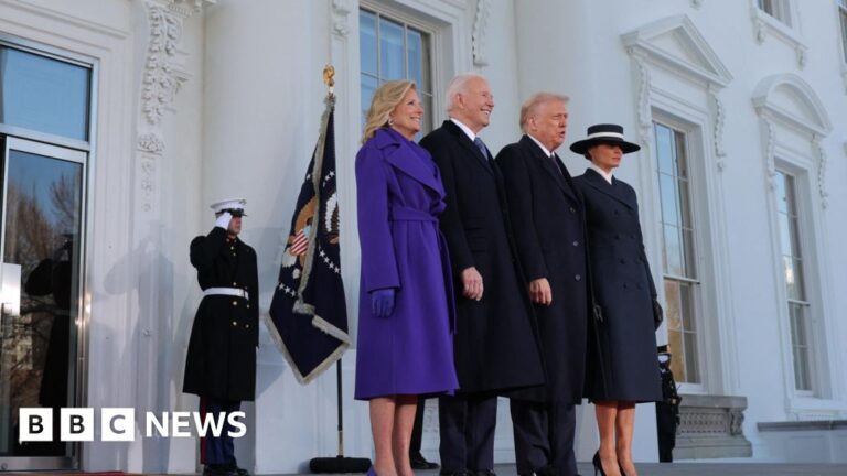 Jill and Joe Biden smile on the steps of the White House, as they stand next to the Trumps