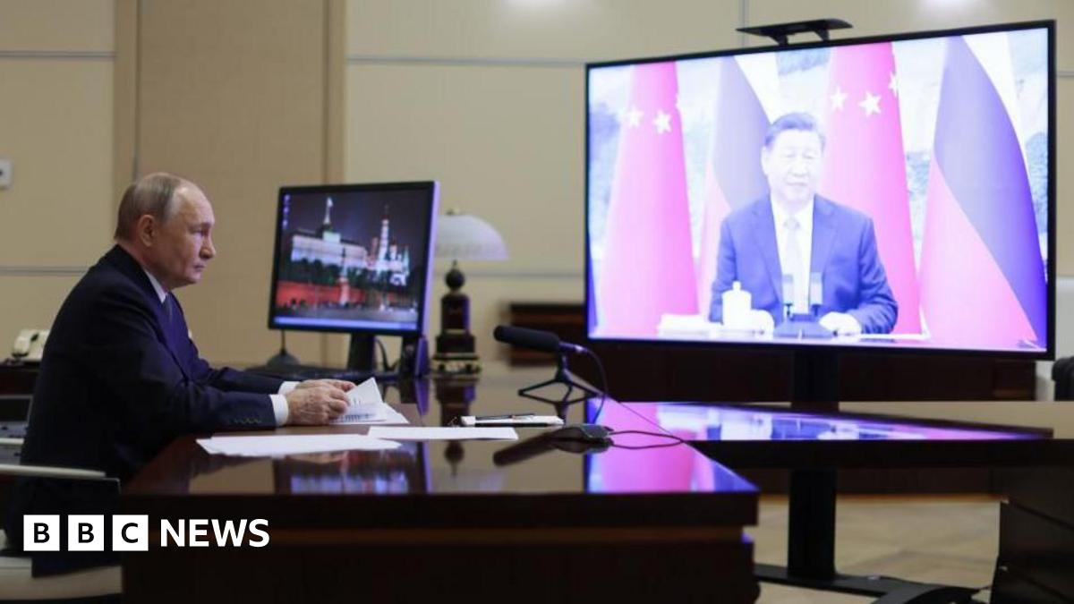 Russian President Vladimir Putin holds a meeting with Chinese President Xi Jinping (on screen) via video conference at the Novo-Ogaryovo state residence, outside Moscow, Russia, 21 January 2025.