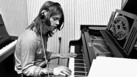 Have a picture of Ozzy playing piano