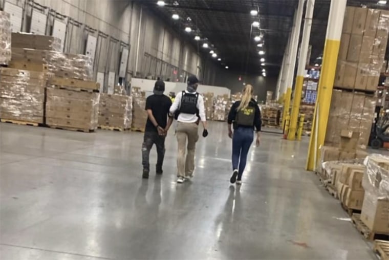 Officer captures people inside the warehouse.