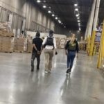 Officer captures people inside the warehouse.