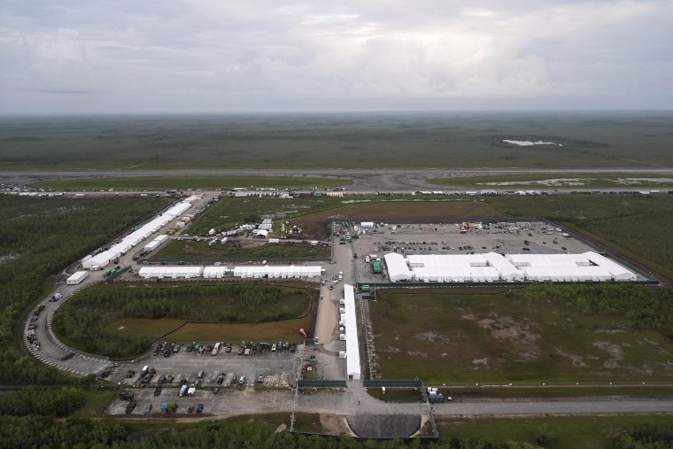 Work progress in a dolbed prisoner facility "Alligator Alcatraz," Took everglades on July 4, 2025, in Ochopee, flag.
