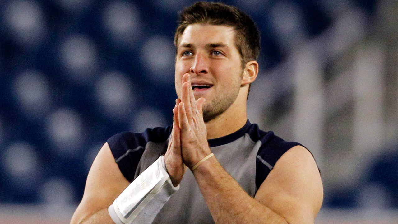Tim Tebow held a workout for MLB teams in hopes of landing a job in pro baseball. (Elise Amendola/AP)