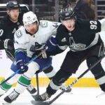 Kemp scored in overtime as the Kings downed the Canucks

