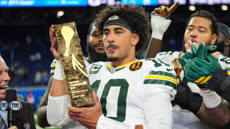 Love matched a career high with four TD passes to lead the Packers to a win over the Lions