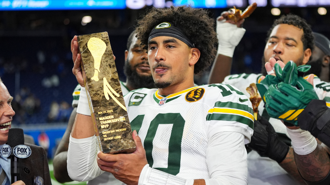 Love matched a career high with four TD passes to lead the Packers to a win over the Lions