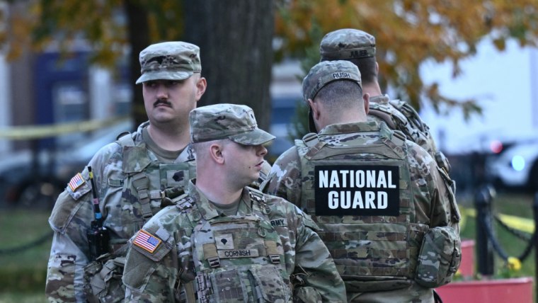 Officials show photos of 2 members of the national guard