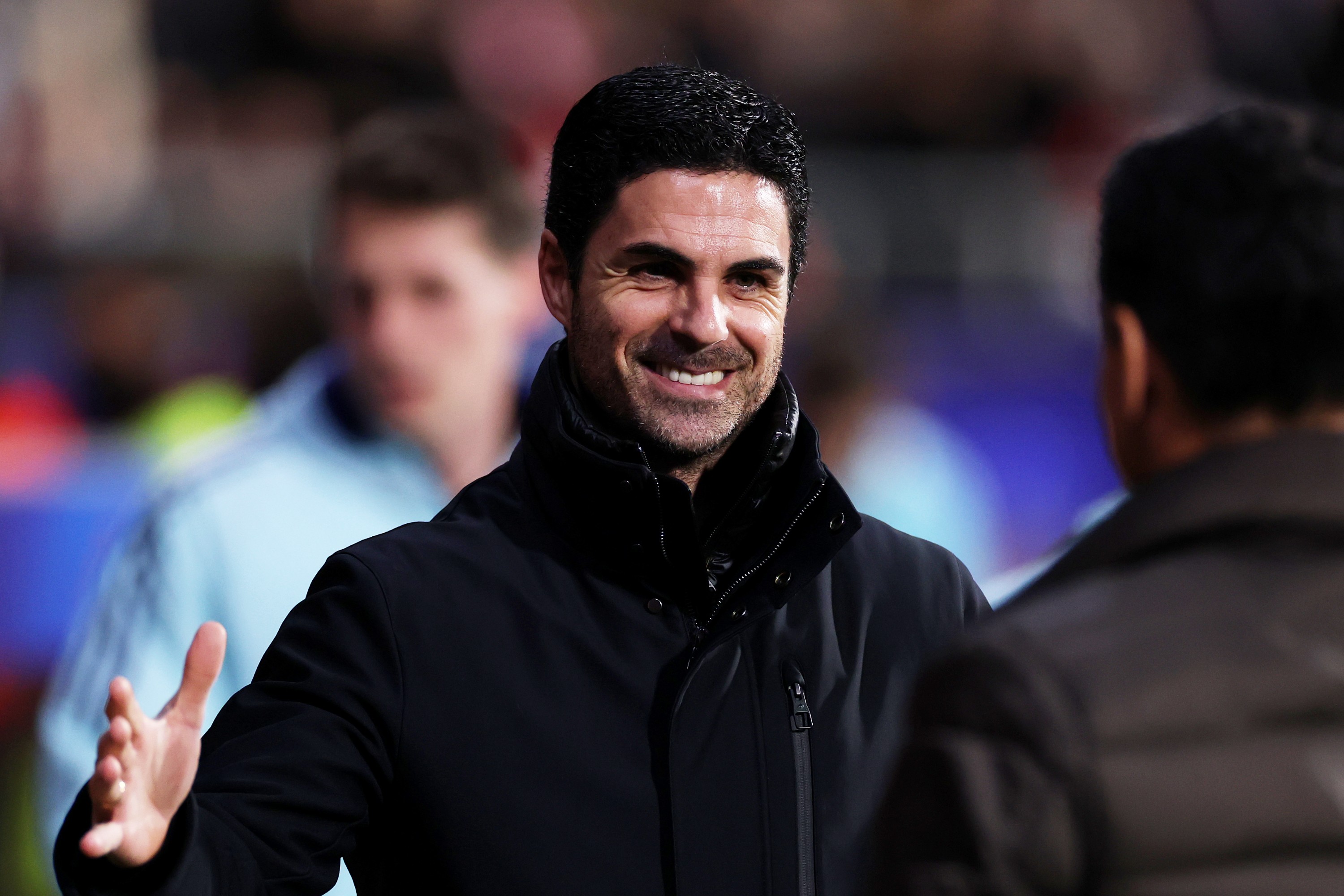 Mikel Arteta, Manager of Arsenal, and Michel, Head Coach of Gironta FC, interact