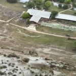 Aerial view of Camp Da Junta outside, flood damage can be seen on the surrounding land